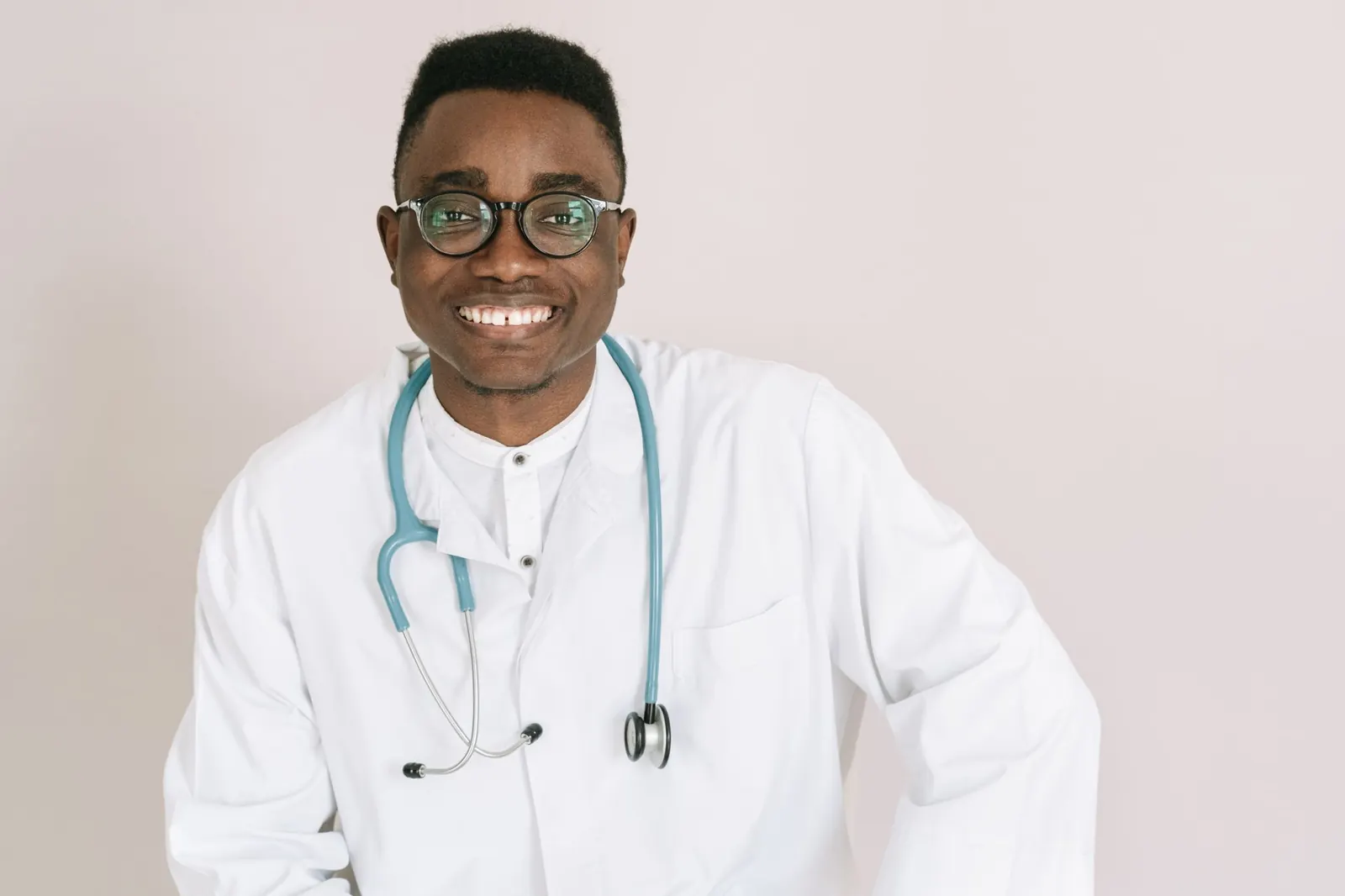 Smiling doctor in a white coat with a stethoscope